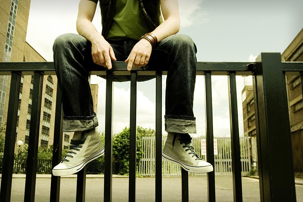 youth on a fence